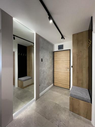 a room with two beds and a large mirror at President Lux Apartment in Pale
