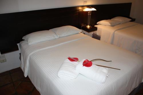 Hotel Casa Real Del Caféにあるベッド