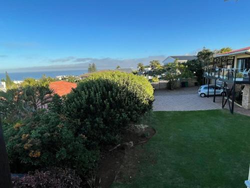 an aerial view of a yard with a house at Penthouse at Casa Esda in Jeffreys Bay