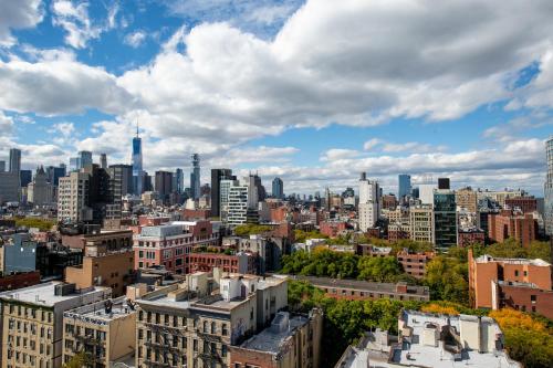 a view of a city skyline with buildings at Orchard Street Hotel in New York