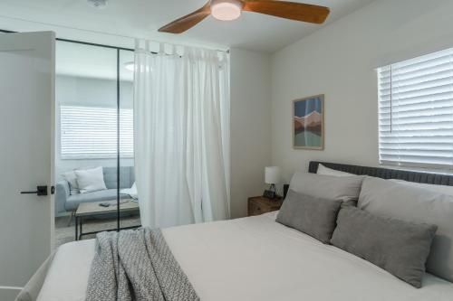 a bedroom with a bed and a ceiling fan at Luxury Tiny Home 2 Miles from Downtown Orlando in Orlando
