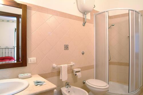 a bathroom with a shower and a toilet and a sink at Il Castello in Petralia Sottana