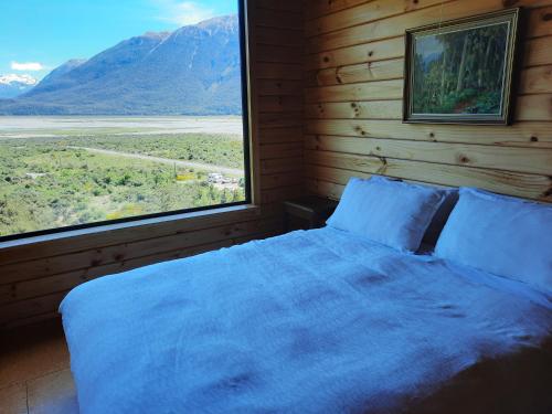 En eller flere senge i et værelse på Arthur's Pass Ecolodge