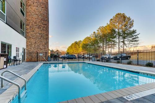 a swimming pool in front of a building at Holiday Inn Express & Suites - Dawsonville, an IHG Hotel in Dawsonville