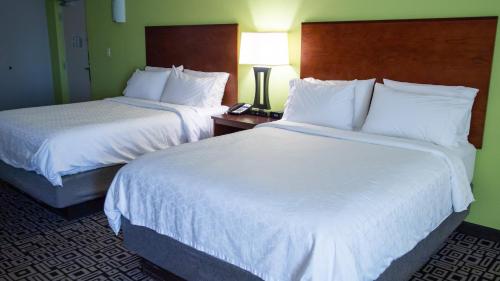a hotel room with two beds and a telephone at Holiday Inn Express Hickory - Hickory Mart by IHG in Hickory