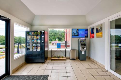 a gas station with a soda machine in a room at Motel 6-Gainesville, GA in Gainesville