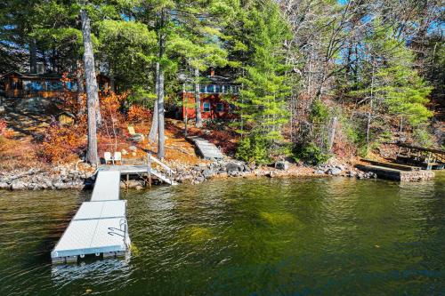 a dock in the middle of a body of water at The Red Camp in Casco