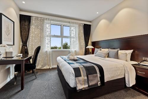 Ένα ή περισσότερα κρεβάτια σε δωμάτιο στο International Hotel Wagga Wagga