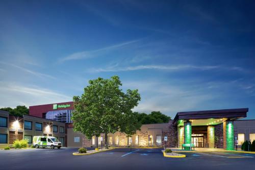 a car parked in front of a hospital at Holiday Inn Poughkeepsie by IHG in Poughkeepsie