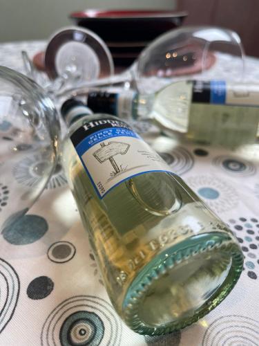 a bottle of wine sitting on top of a table at Cambridge Studios and Suites by Tas Accommodations in Cambridge