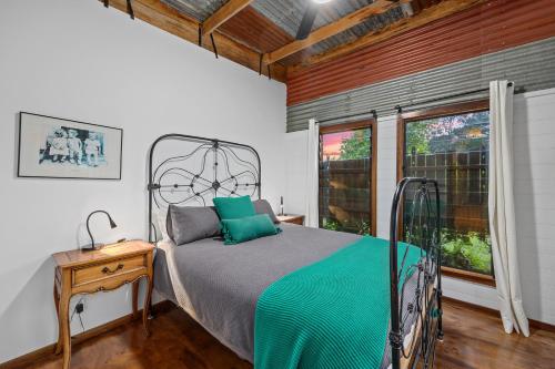 a bedroom with a bed and a window at Sunset Cottage - Yarra Valley in Healesville