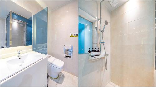 La salle de bains est pourvue de toilettes, d'un lavabo et d'une douche. dans l'établissement Hotel The One, à Yeosu