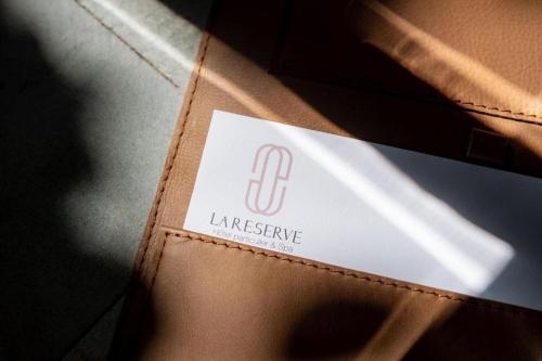 a brown leather wallet with a label on it at La Reserve 1785 Canggu Beach - Adults Only in Canggu