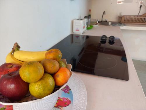a bowl of fruit on a counter in a kitchen at Casona del Negro Aguilar in Valladolid