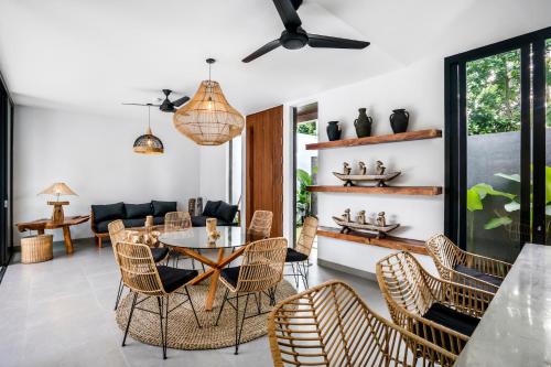 a living room with a table and chairs at Villa Jump by BaliSuperHost in Ubud