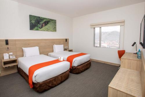 Un pat sau paturi într-o cameră la Casa Andina Standard Cusco San Blas