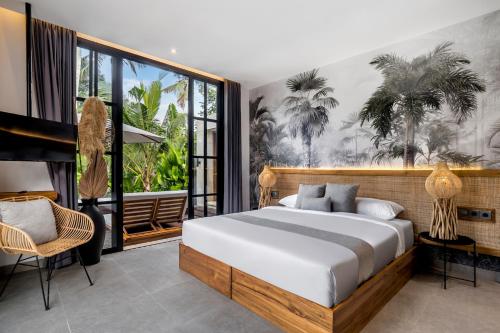 a bedroom with a bed and a large window at Villa Hammock by BaliSuperHost in Ubud