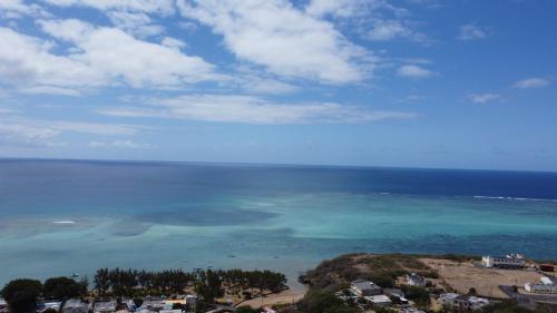 a view of the ocean from the top of a mountain at Eagles Nest Residence in Rodrigues Island