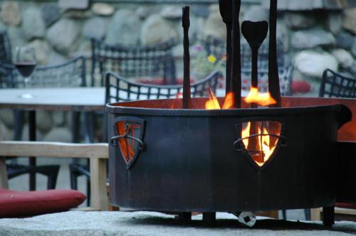 a fire pit sitting in front of a table at PlumpJack Inn in Olympic Valley