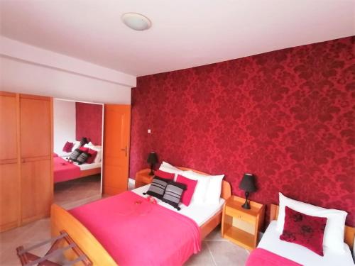 Кровать или кровати в номере Apartments Villa Kukoljac