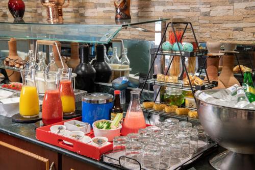a counter with a bunch of bottles and glasses at Radisson Blu Hotel, Yanbu in Yanbu