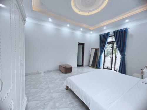 Cama o camas de una habitación en Villa Blueware - Venuestay