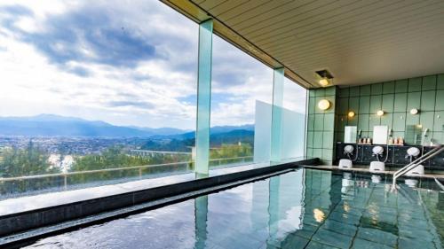 a house with a swimming pool with a view at Kyukamura Setouchi-Toyo in Saijo