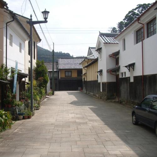 an empty street in a town with houses at Kyukamura Setouchi-Toyo in Saijo