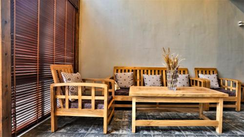 a table and chairs on a patio with a table at Dakpa House Ladakh in Ranbirpura