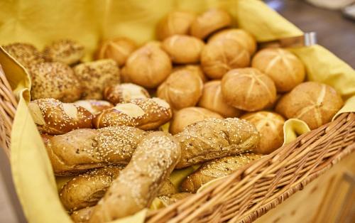 a basket filled with lots of different types of bread at Am Mitteregghof in Saalbach Hinterglemm