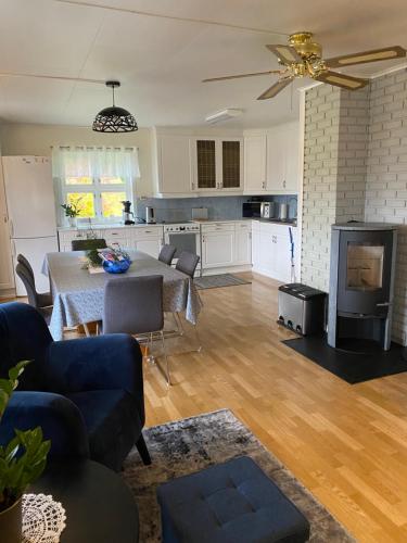 a living room with a table and a kitchen at The house of Mattis in beautiful Innvik in Innvik