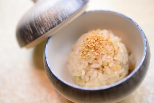 a bowl of rice and a spoon on a table at Hakone Gora Byakudan in Hakone