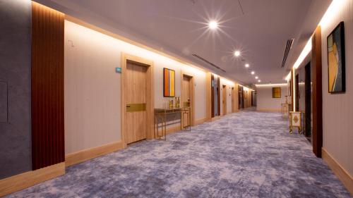 a corridor of a corridor with a hallway at Wyndham Garden Baku in Baku