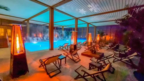 an overhead view of a patio with chairs and a pool at Grand Hotel Pomorie - Medical spa in Pomorie