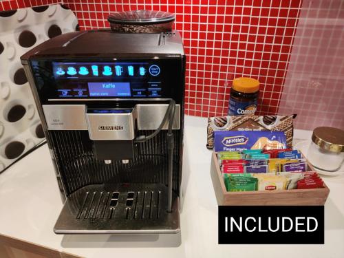 a coffee maker sitting on a counter next to a box at Luxury Villa 130 m2 centrally in Katrineholm