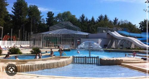 a group of people in a pool at a water park at Mobilhome 6/8 personnes Piriac sur Mer in Piriac-sur-Mer