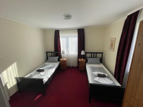 Postel nebo postele na pokoji v ubytování Hotel Leitner
