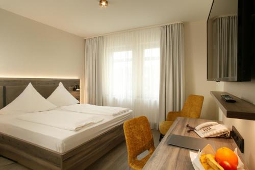 Postel nebo postele na pokoji v ubytování Hotel Sonne Rudersberg