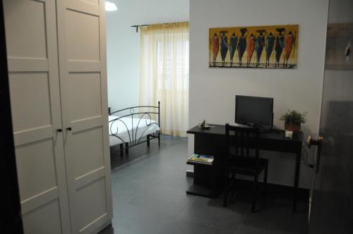TV a/nebo společenská místnost v ubytování B&B Largo Barile