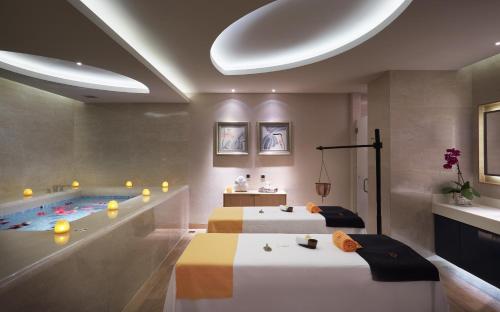 a hotel room with two beds and a swimming pool at Gran Melia Xi'an in Xi'an