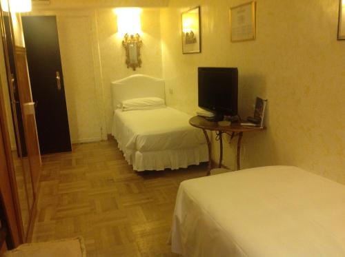 Cama o camas de una habitación en Hotel Fontana