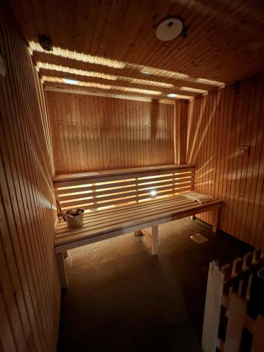 a bench in a sauna with a light on it at Saltstraumen Hotel in Saltstraumen