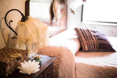 a bedroom with a bed and a table with a dresser at Freelandros Villa in Nardodipace