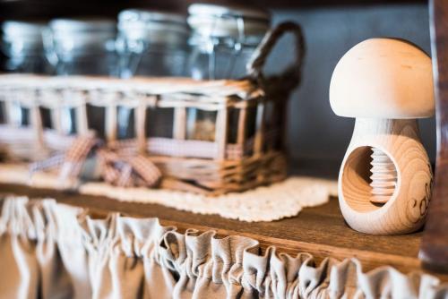 a wooden object sitting on a shelf with a basket at Freelandros Villa in Nardodipace