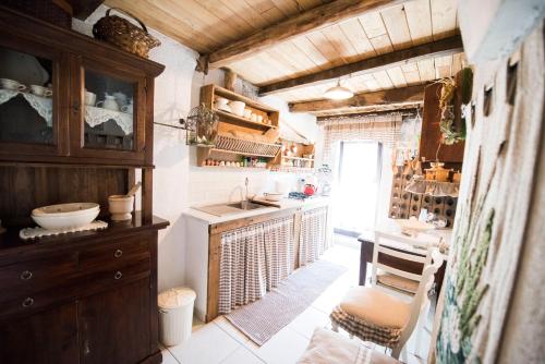 a kitchen with a counter and a sink in a room at Freelandros Villa in Nardodipace