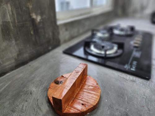 a wooden block sitting on a counter next to a stove at MP Villa with Cinema Room in Hock Lam Village