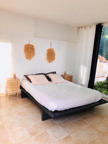 Voodi või voodid majutusasutuse Chambre d’hôte vue mer toas
