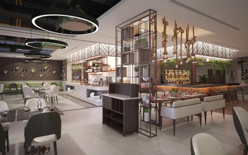 a rendering of a restaurant with tables and chairs at DAMAC Hills 2 Hotel, an Edge by Rotana Hotel in Dubai