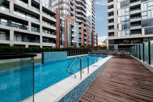 a swimming pool on the side of a building at 2BR Mason Square @ Moonee Ponds in Melbourne