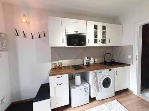 Kuchyňa alebo kuchynka v ubytovaní Apartamenty Waligóra